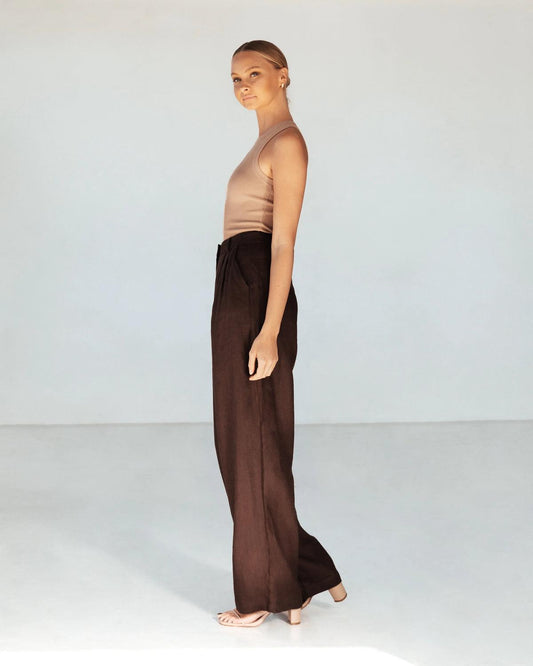 Effortless flow. Elevated comfort.
The Castaway Pants are designed with a high-rise waist and a wide-leg silhouette, offering a relaxed yet refined fit. Crafted from lightweight, breathable fabric, they drape beautifully for all-day ease. Perfectly tailored with side pockets and a flattering length, these pants transition seamlessly from casual days to polished evenings.