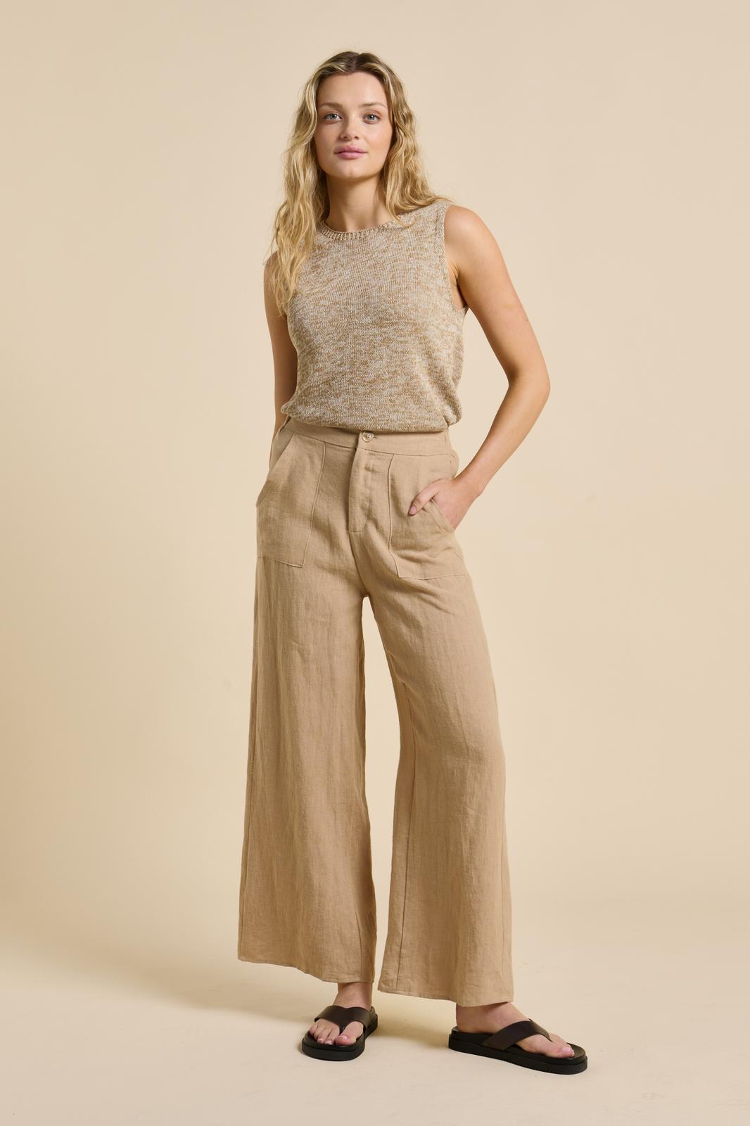 Lightweight, effortless, and endlessly versatile – the Melanie Spring Tank is your go-to knit for warm, breezy days. Crafted in a soft neutral marle, this sleeveless style features a classic round neckline and a relaxed fit that drapes beautifully on the body. Perfect for layering or wearing solo, its breathable knit makes it an easy staple for spring and summer dressing.