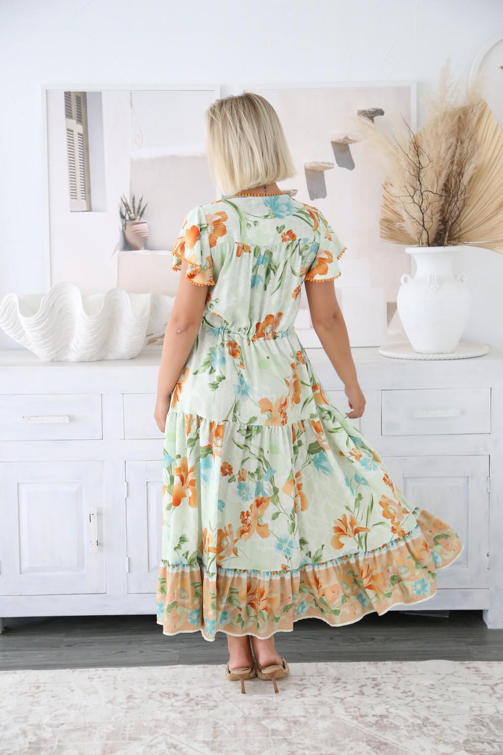 Step into effortless elegance with the Isla Midi Dress, a floaty, feminine piece designed to brighten your wardrobe. With its soft pastel base adorned in vibrant orange, green, and aqua floral prints, Isla is the perfect blend of fresh, playful, and chic.