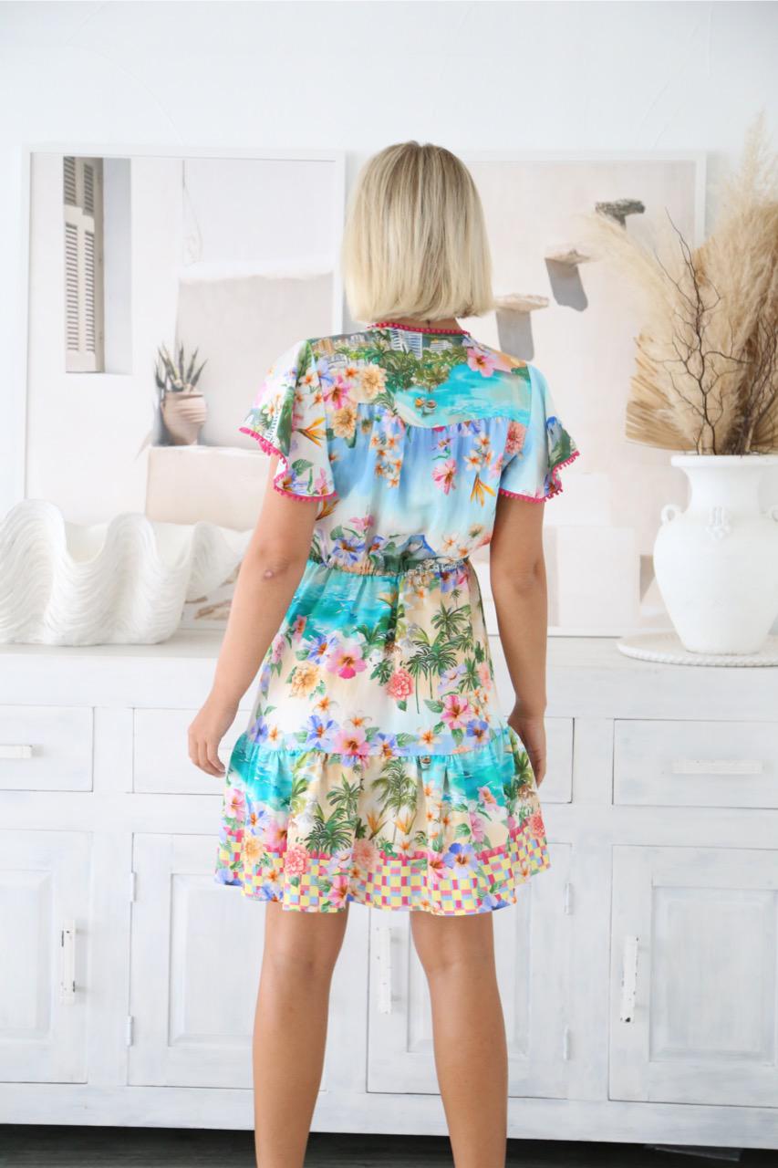 Bright, playful, and made for sunshine days — the Summer Mini Dress is the ultimate vacation-ready piece. Bursting with tropical charm, this dress features a lively coastal-inspired print with vibrant florals, ocean hues, and a fun checked border that instantly lifts your mood.