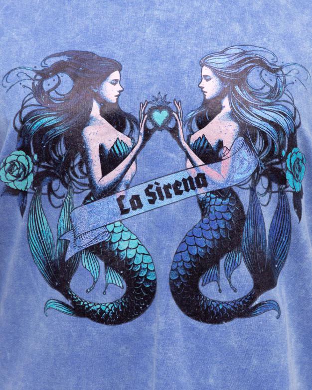Dive into effortless style with the La Sirena Tee. Crafted in a washed blue cotton for a perfectly lived-in feel, this oversized tee features a bold twin mermaid graphic with “La Sirena” across the front. With its relaxed fit, drop shoulders, and vintage-inspired finish, it’s the ultimate statement piece for laid-back days and ocean dreamers.