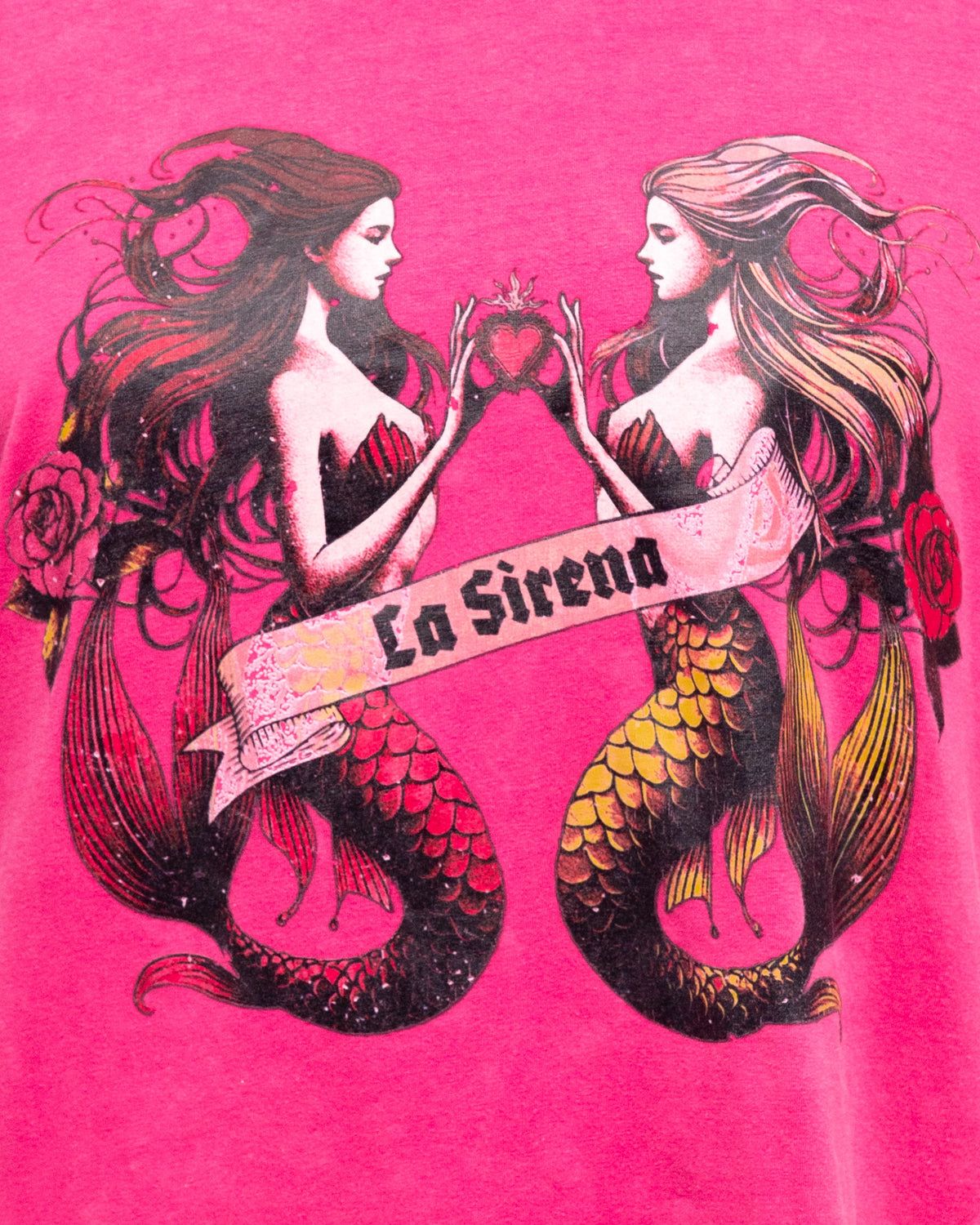 Make waves in the La Sirena Tee in pink. Designed in a relaxed, oversized fit with a soft vintage wash, this tee showcases the striking twin mermaid “La Sirena” graphic across the front. Effortlessly bold yet laid-back, it’s the perfect piece to add a splash of ocean-inspired charm to your everyday wardrobe.