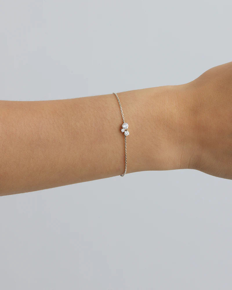 The Whispers of Love Bracelet features a classic trio design with an asymmetrical twist with varying sizes of round-cut crystals. This piece is a visual poem to the simplicity of love - and all the quiet magic it holds. It’s classic and delicate design is the perfect subtle touch of sparkle for the bride looking to shine in her own light. 