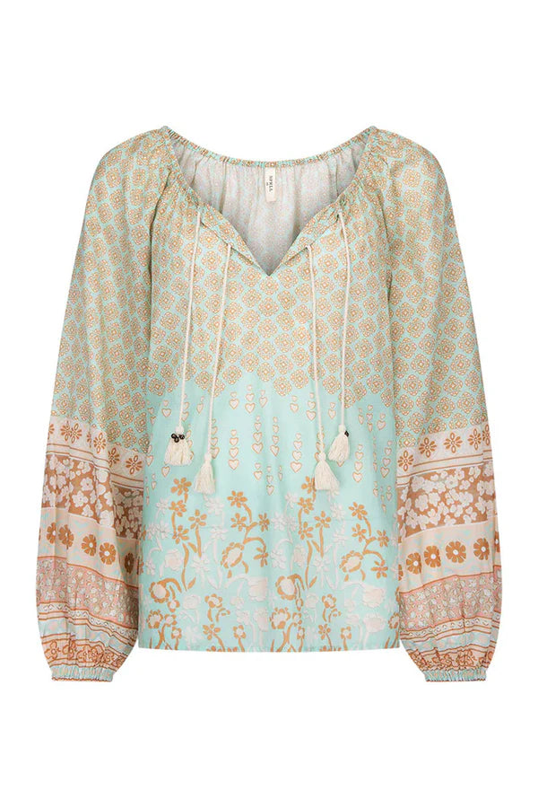 Our Sweet Nothings Blouse in Peppermint evokes the beauty of an ocean breeze. Four tassel-trimmed ties with bells adorn the neckline, allowing you to wear it open or tied for a look that’s both sweet and sophisticated