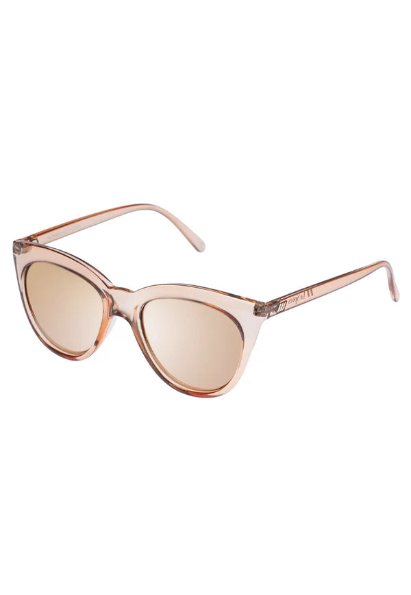 Lending a modern take to the classic cat-eye silhouette, our wardrobe staple HALFMOON MAGIC has been carefully designed to flatter all face shapes. With sweeping lines and midsize proportions, this style is finished with the iconic Le Specs flagstripe metal hardware on both temples. Finished in a rich translucent frame paired with tonal mirrored lenses.