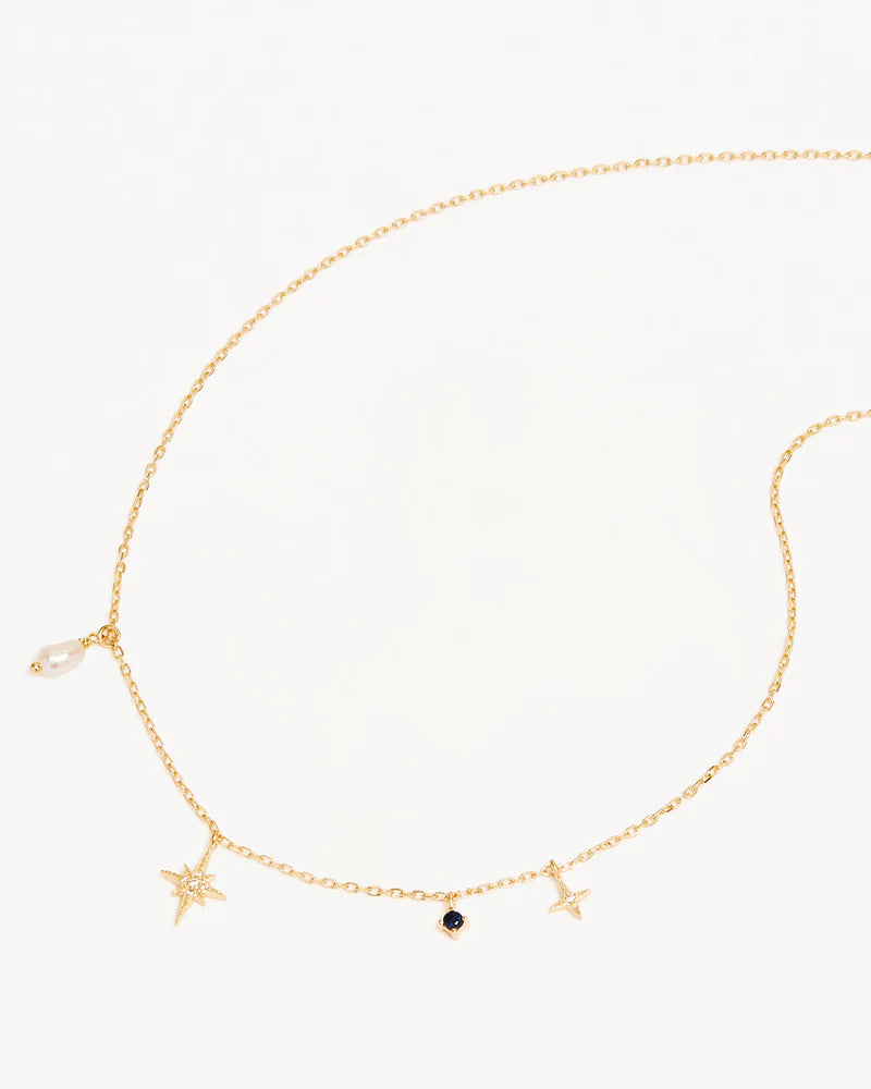 Layer yourself in the heavens with our Stardust Choker, a delicate adornment that weaves together each beautifully unique element of the night sky. Our choker features a Freshwater Pearl which symbolises the illuminating moonlight, a divine Sapphire for the infinite night sky, and two crystal encrusted Stars for the celestial bodies that eternally guide us.