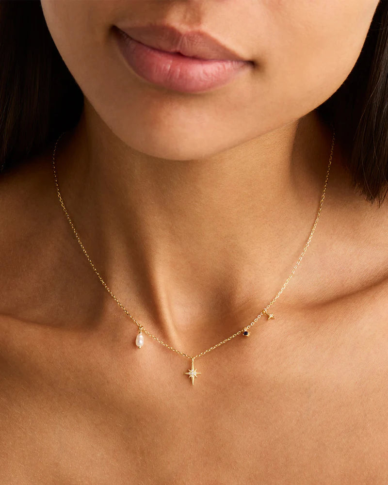 Layer yourself in the heavens with our Stardust Choker, a delicate adornment that weaves together each beautifully unique element of the night sky. Our choker features a Freshwater Pearl which symbolises the illuminating moonlight, a divine Sapphire for the infinite night sky, and two crystal encrusted Stars for the celestial bodies that eternally guide us.