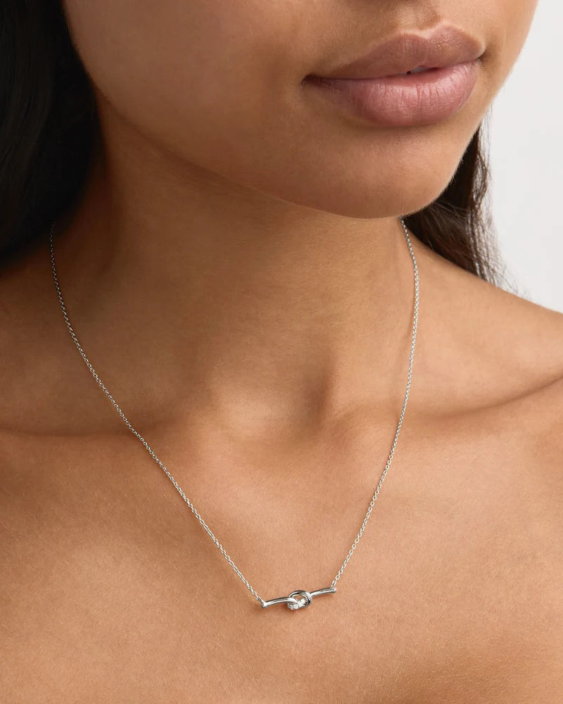 Our Sterling Silver Love Knot Lab-Grown Diamond Necklace serves as a delicate reminder of unbreakable bonds and the cherished connections that shape our lives. This delicate knot-bar necklace is adorned with ethically sourced GH-SI lab-grown diamonds in a pavé setting. Fixed on our signature fine chain, this keepsake will be cherished forever. Available in 18k gold vermeil and 925 sterling silver. 