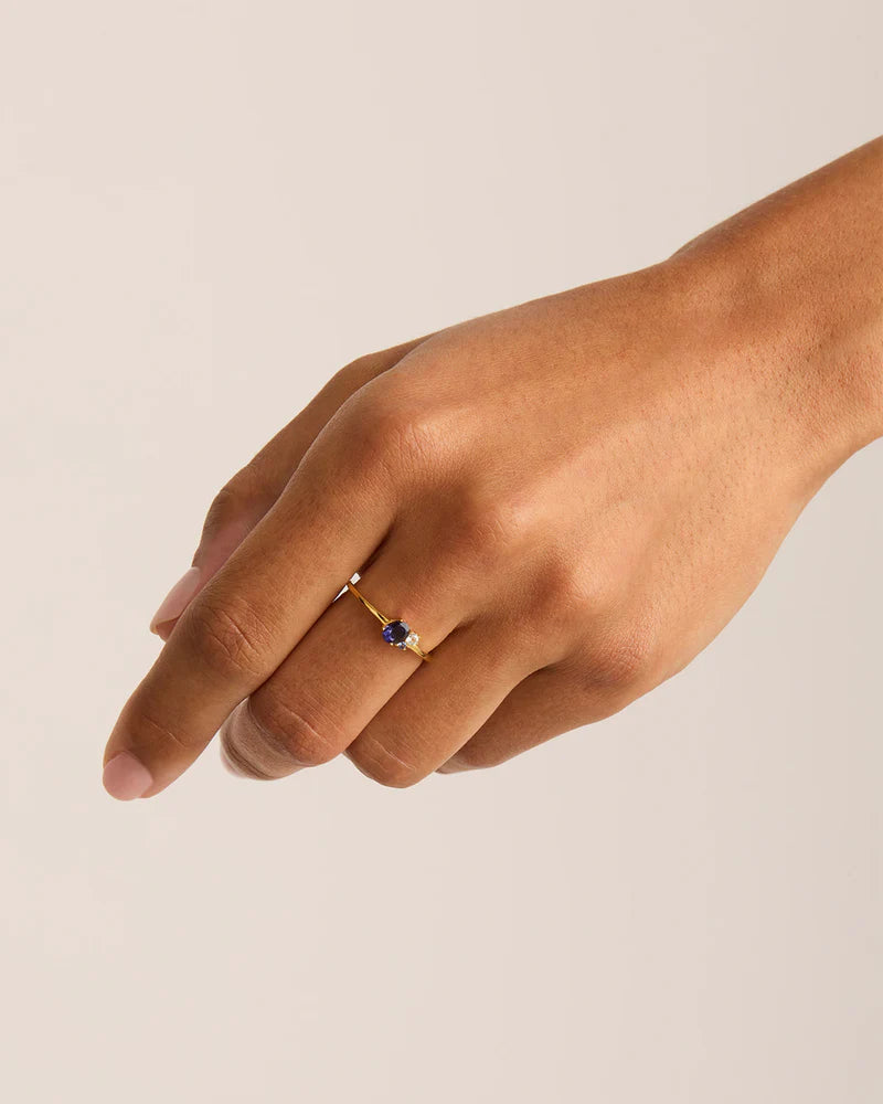 Our Gold Kindred September Birthstone Ring features a kaleidoscopic cluster of ethically and sustainably sourced natural iolite, blue topaz, and blue sapphire. The September birthstone, sapphire, is believed to symbolise wisdom, loyalty, and the vast possibilities of the universe, making it a cherished symbol of virtue. This subtle stackable ring mirrors the hues of a rainbow, illuminating the diverse connections that infuse joy into our lives. 