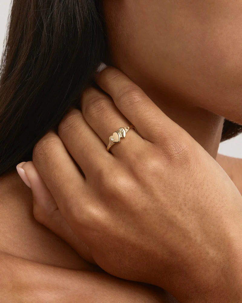 Vintage and keepsake inspired, the Forever Intertwined Heart Signet Ring features a traditional engraving detailing with a lotus bloom twist. A nostalgic design that reminds us of the bonds that are forever embedded in our hearts and the memories that will forever connect us. Available in 18k gold vermeil and 925 sterling silver. 