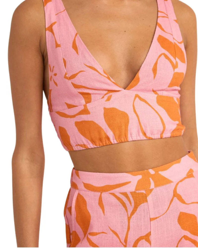 Stay cool and stylish in the Rhythm Bora Bora Floral Top. This pink cropped top combines a fitted bodice with a comfortable back smocked panel and elasticated strap. The deep V neckline and side straps add a touch of allure. Made with a lightweight rayon linen blend (70% rayon, 30% linen), it's ideal for summer. Find your perfect fit with this trendy women's fashion top.