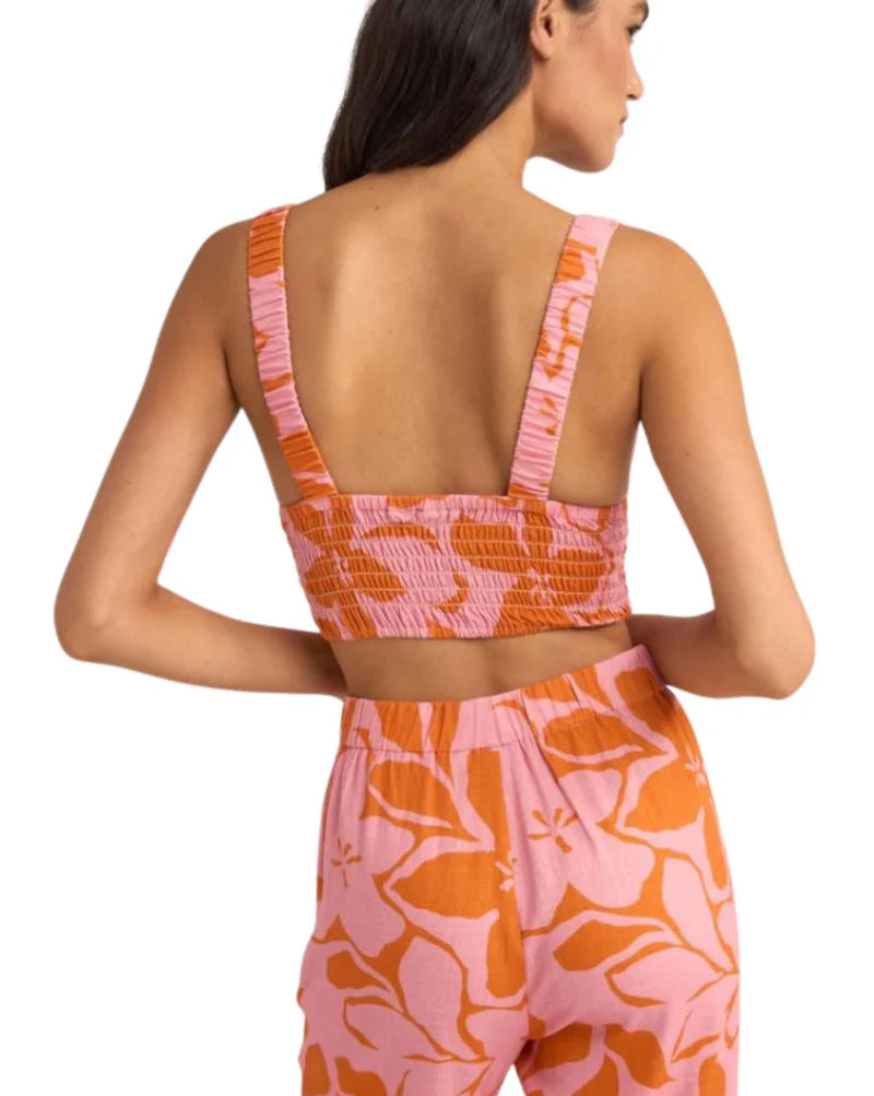Stay cool and stylish in the Rhythm Bora Bora Floral Top. This pink cropped top combines a fitted bodice with a comfortable back smocked panel and elasticated strap. The deep V neckline and side straps add a touch of allure. Made with a lightweight rayon linen blend (70% rayon, 30% linen), it's ideal for summer. Find your perfect fit with this trendy women's fashion top.