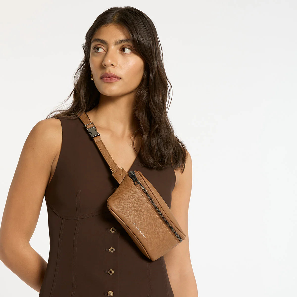 There's no denying the humble bum bag has a shady past...but times are a-changing. Featuring a wide opening main zip compartment, gunmetal hardware and secret stash back zip pocket.