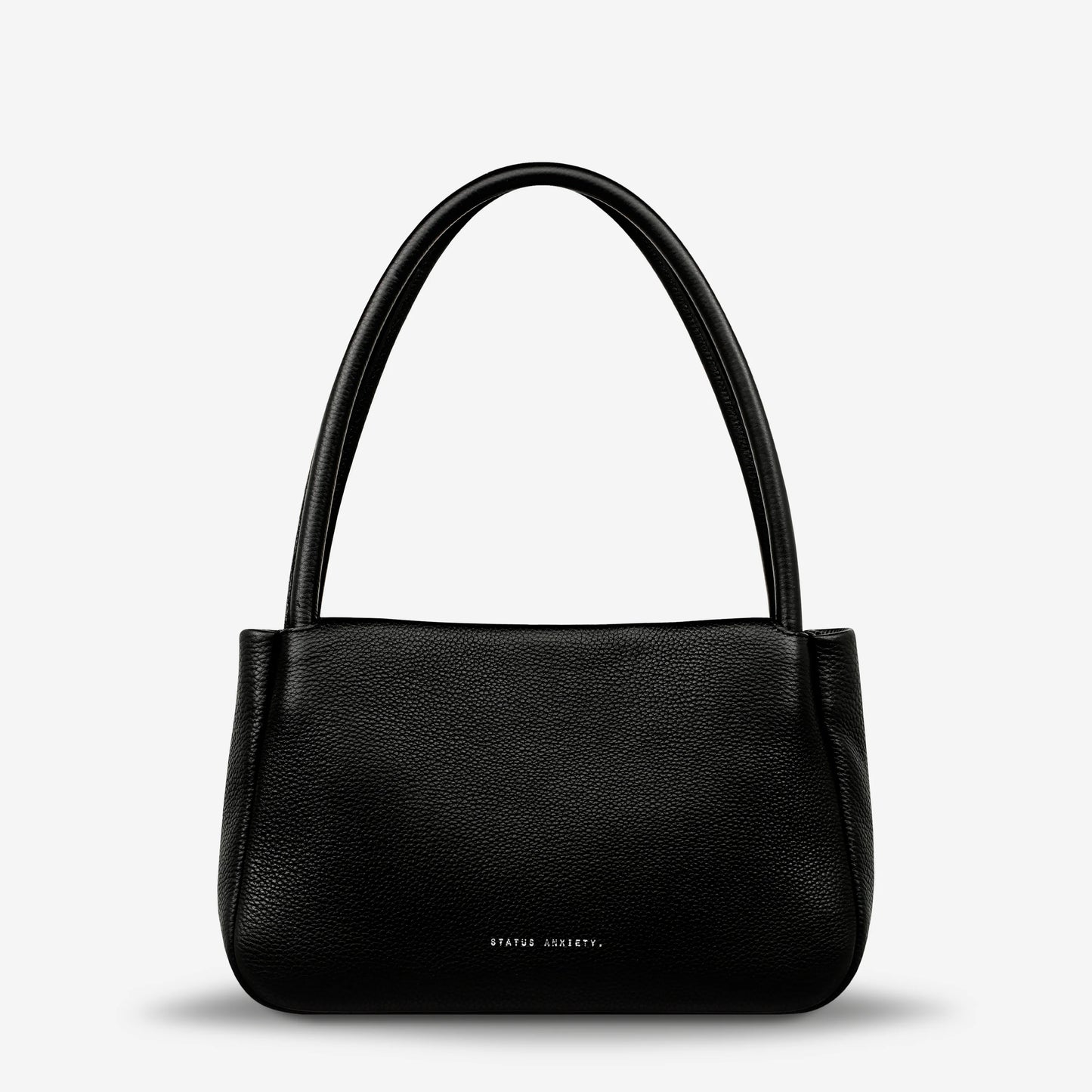 If you think about something in the cold light of day, you think about it clearly and calmly without emotion. In much the same way, the 'Light of Day' handbag isn't caught up with unnecessary, over the top design features. With its more structured form and thoughtful simplicity the LOD bag makes for the perfect day to night bag. With generous straps it can be comfortably worn over the shoulder or elbow and features a wide opening main compartment, with zipper pocket, open pockets, and clip for your keys.