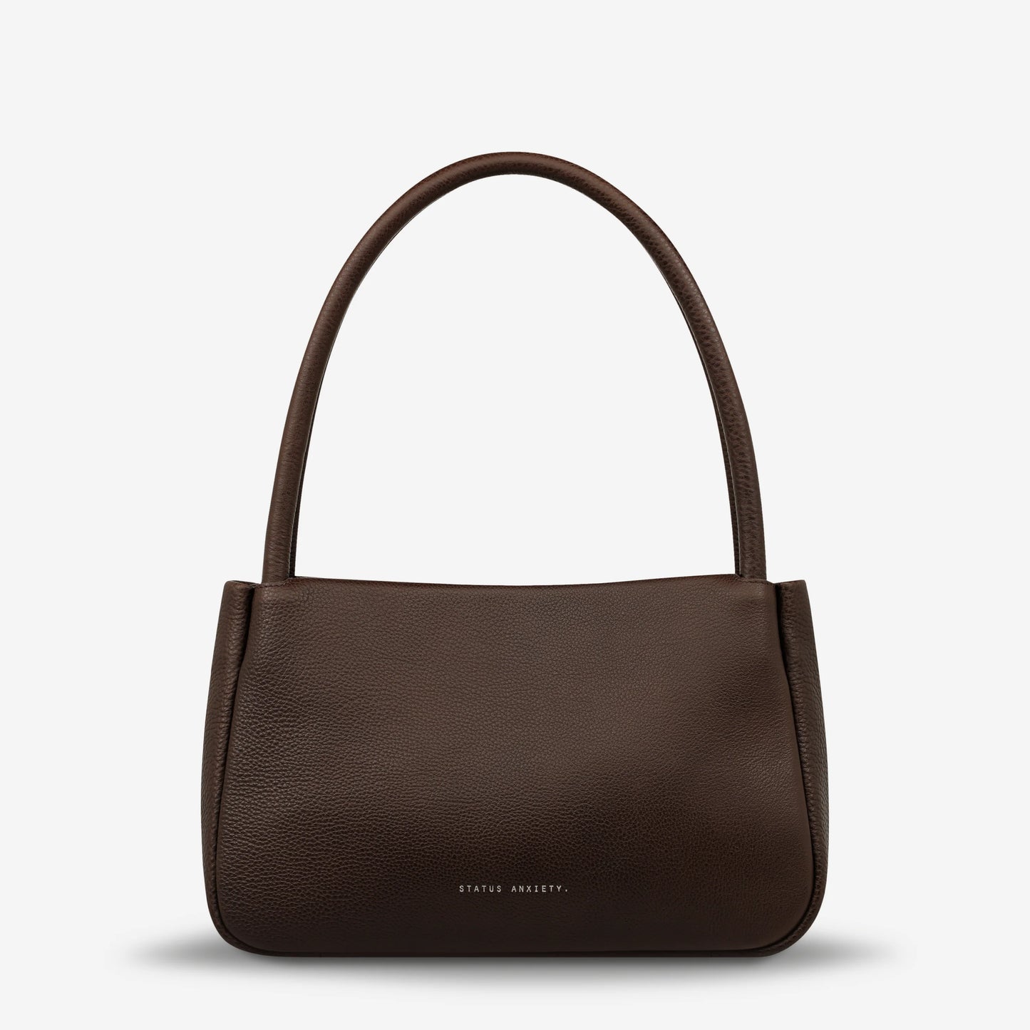 If you think about something in the cold light of day, you think about it clearly and calmly without emotion. In much the same way, the 'Light of Day' handbag isn't caught up with unnecessary, over the top design features. With its more structured form and thoughtful simplicity the LOD bag makes for the perfect day to night bag. With generous straps it can be comfortably worn over the shoulder or elbow and features a wide opening main compartment, with zipper pocket, open pockets, and clip for your keys.