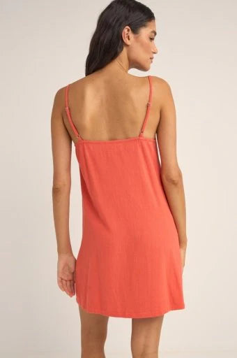 Indulge in effortless coastal style with Seacoast Keyhole Slip Dress. This coastal gem features a scoop neckline, a front keyhole with a tie, and an under bust panel for a flattering fit. The fitted bodice effortlessly flows into a slightly fitted skirt, while binding on the front and back openings adds a touch of elegance. Adjustable spaghetti straps ensure a personalized fit, and resin bead detailing at the centre front tie completes the look with coastal charm.