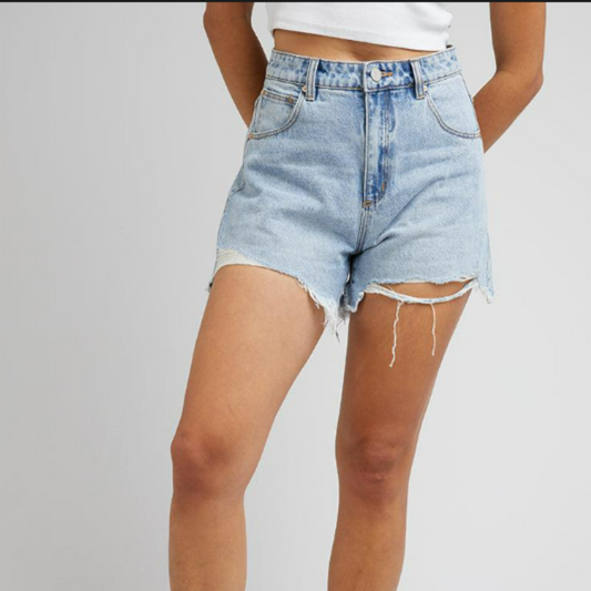 The Suzie Ripped Shorts by ABRAND are high rise relaxed shorts made from 100% cotton, rigid denim with light vintage blue wash