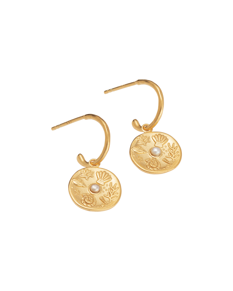 Impassioned by the ocean, and observing the delicacy of its intrinsic treasure, these By The Sea Hoops pay homage to the subtle and sculptural detail the waves deliver at the turning of each tide
