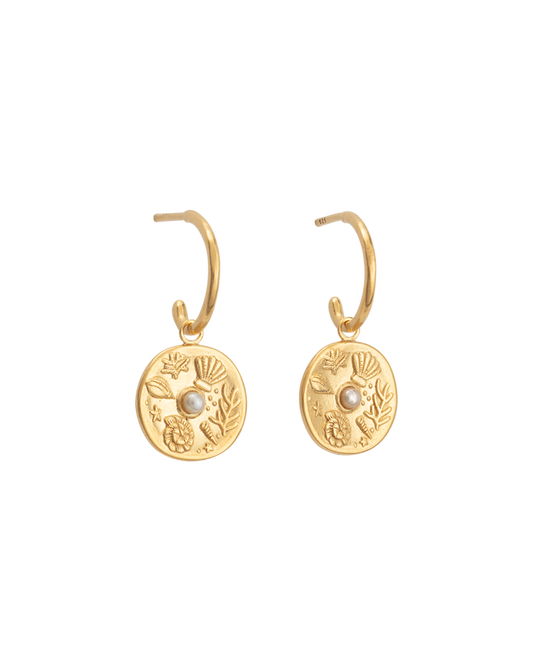 Impassioned by the ocean, and observing the delicacy of its intrinsic treasure, these By The Sea Hoops pay homage to the subtle and sculptural detail the waves deliver at the turning of each tide.