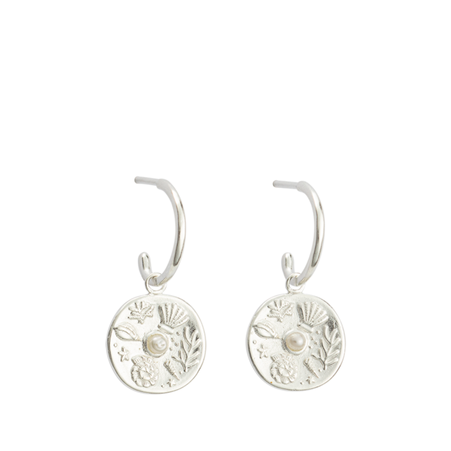 Impassioned by the ocean, and observing the delicacy of its intrinsic treasure, these By The Sea Hoops pay homage to the subtle and sculptural detail the waves deliver at the turning of each tide.