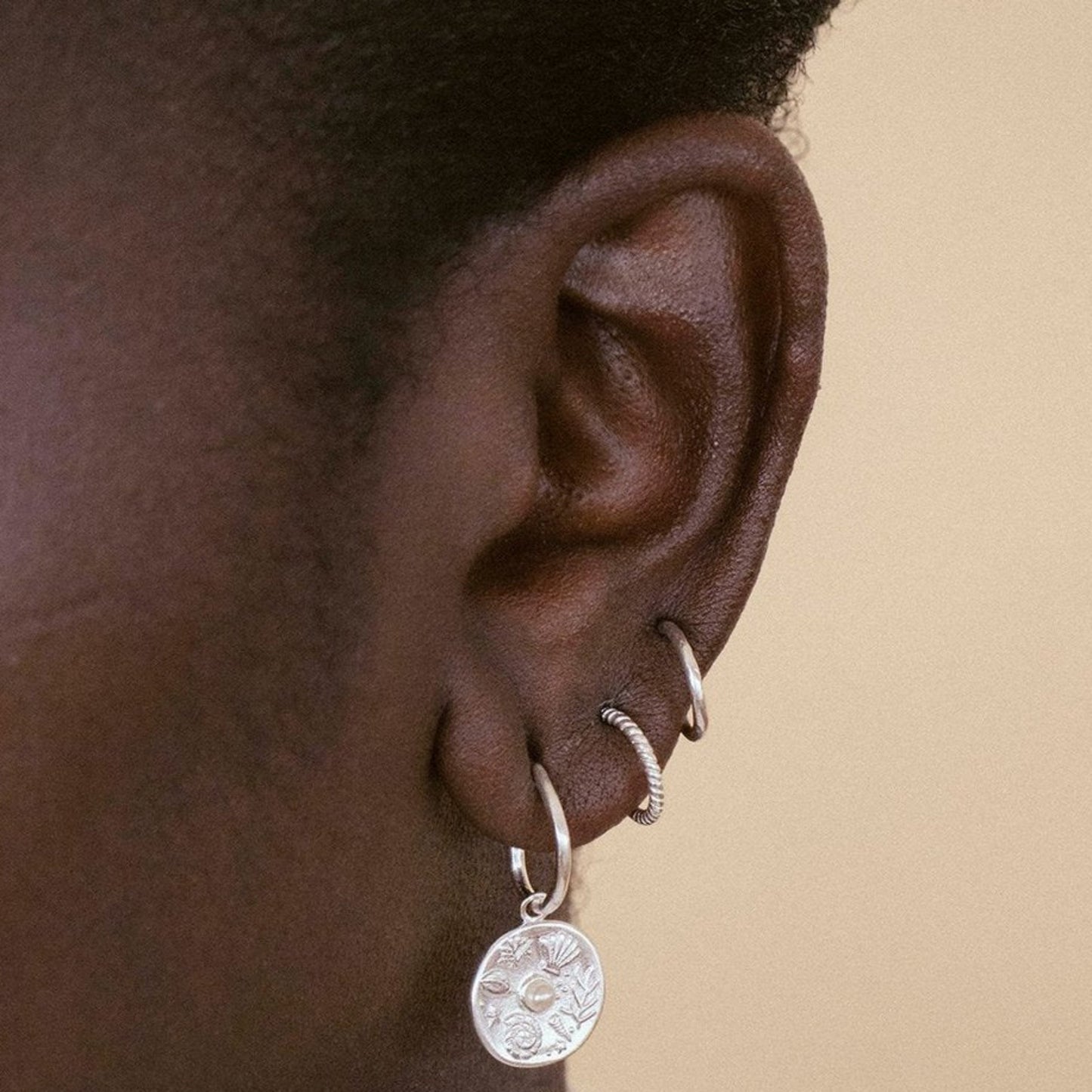 Impassioned by the ocean, and observing the delicacy of its intrinsic treasure, these By The Sea Hoops pay homage to the subtle and sculptural detail the waves deliver at the turning of each tide.