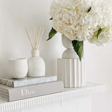 The Sweet Dewberry & Clove Diffuser features matte-white ceramic vessels, that enhance any decor or colour palette whilst scenting your home with the heady aroma of tropical fruit and warm spices.