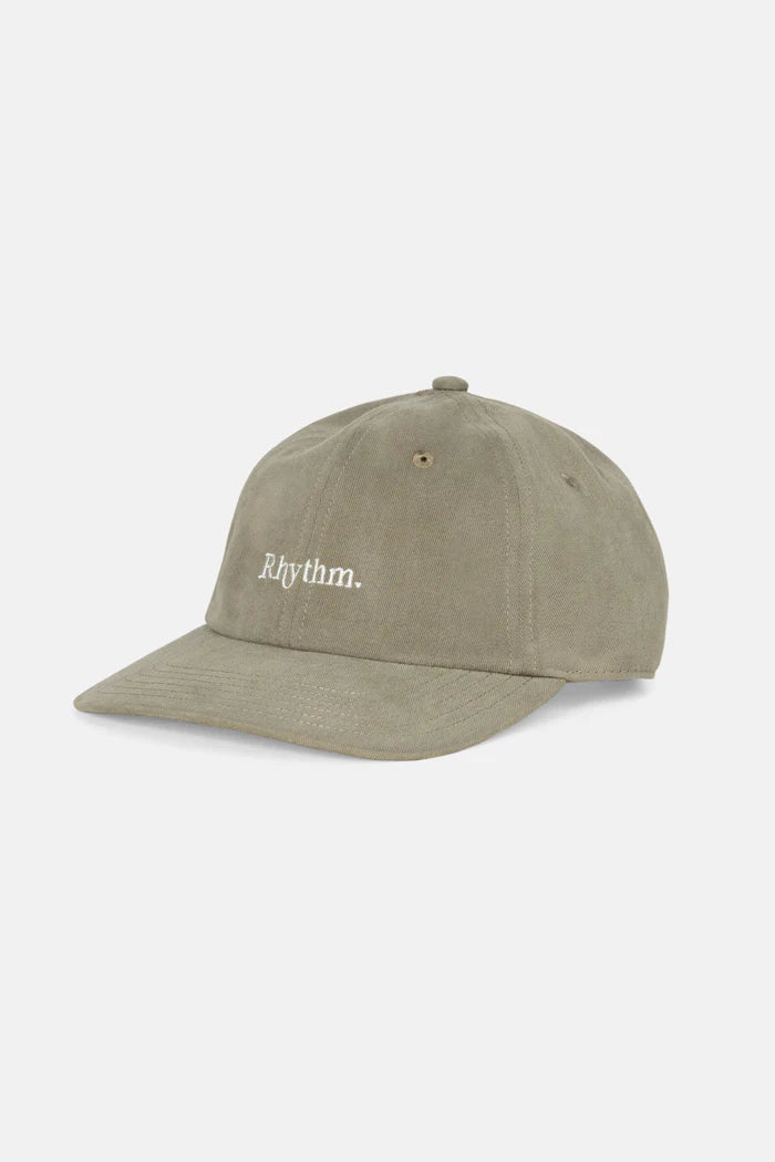 Embrace effortless style with the Essential Brushed Twill Cap in Sea Grass. This classic 6-panel cap boasts a curved peak and an embroidered logo, designed with embroidered eyelets for ventilation. The adjustable strap back closure provides a customizable fit, making it a versatile addition to your coastal wardrobe, finished with signature Rhythm labels and trims.