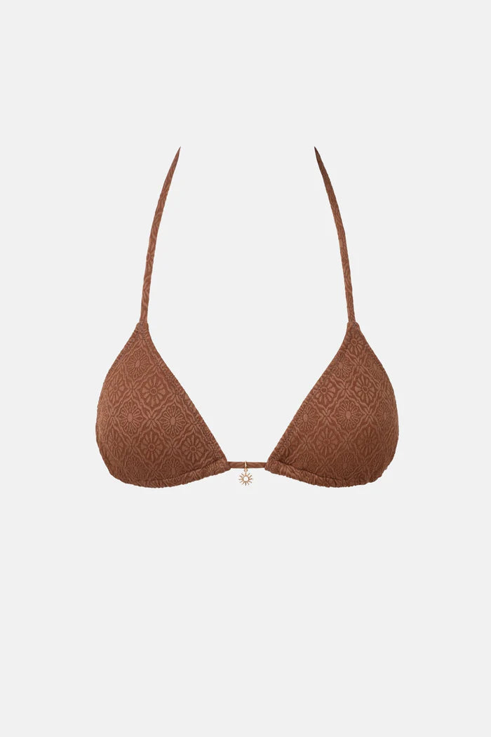 The Sunset Slide Tri Top in Chocolate is designed for A-C cup size with minimal coverage. It features an adjustable halter neck and midriff tie, removable padding, a decorative metal sun trim at the centre front, and a metal coin logo.
