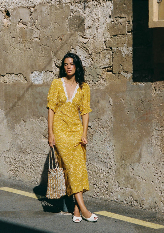 Nothing screams summer like the Mango Polka Dot. The Myles Midi Dress is a brand-new silhouette with a flattering bias-cut shape, contrast lace-trimmed neckline, and soft under-bust gathers. Finished with playful puff sleeves, it’s a feminine summer stand-out made for sunshine days.

Our studio model Yulia is 175cm / 5' 9” and wears a Size S.