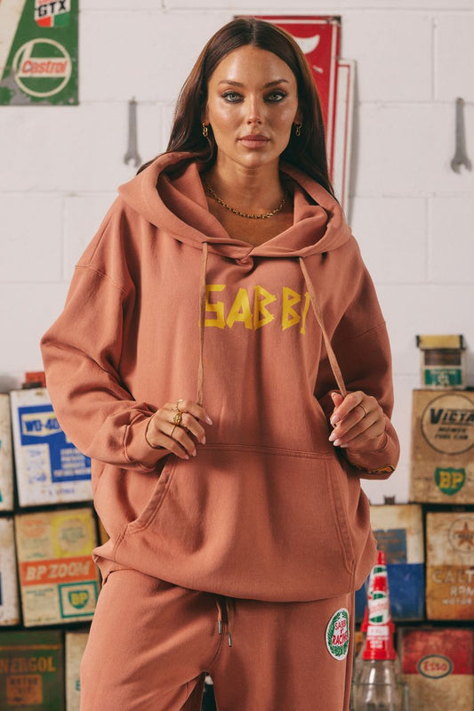 Stay bold, cozy, and kind in the Be Kind Hoodie in a warm terracotta hue. Made for comfort and attitude, this oversized hoodie features a standout yellow “SABBI” graphic across the chest, with dropped shoulders and a roomy front pocket for ultimate laid-back vibes. Crafted from premium cotton fleece, it delivers a soft, lived-in feel with a streetwear edge.