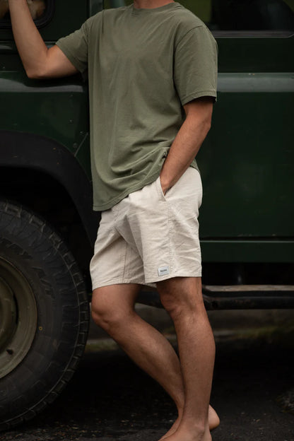The Classic Linen Jam is a relaxed elastic waist short crafted in durable linen cotton blend mid-weight fabric, this style fits 17" above the knee and features side pockets and a back patch pocket, including an elastic waist with an adjustable drawcord, designed for everyday comfort and wear.
