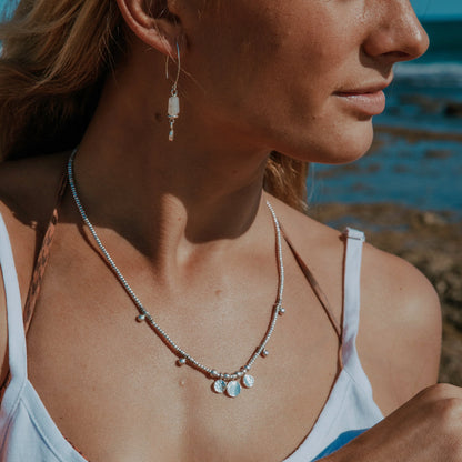 Wrap yourself in the serene beauty of our Oasis Wrap. Handcrafted with Hilltribe Silver beads and adorned with Hilltribe Silver charms, this wrap bracelet embodies tranquility and elegance. The sterling silver clasp and 7-link adjustable chain provide a secure and customizable fit on your wrist. Let the Oasis Wrap be a symbol of your inner sanctuary, bringing a sense of peace and serenity to your everyday style.