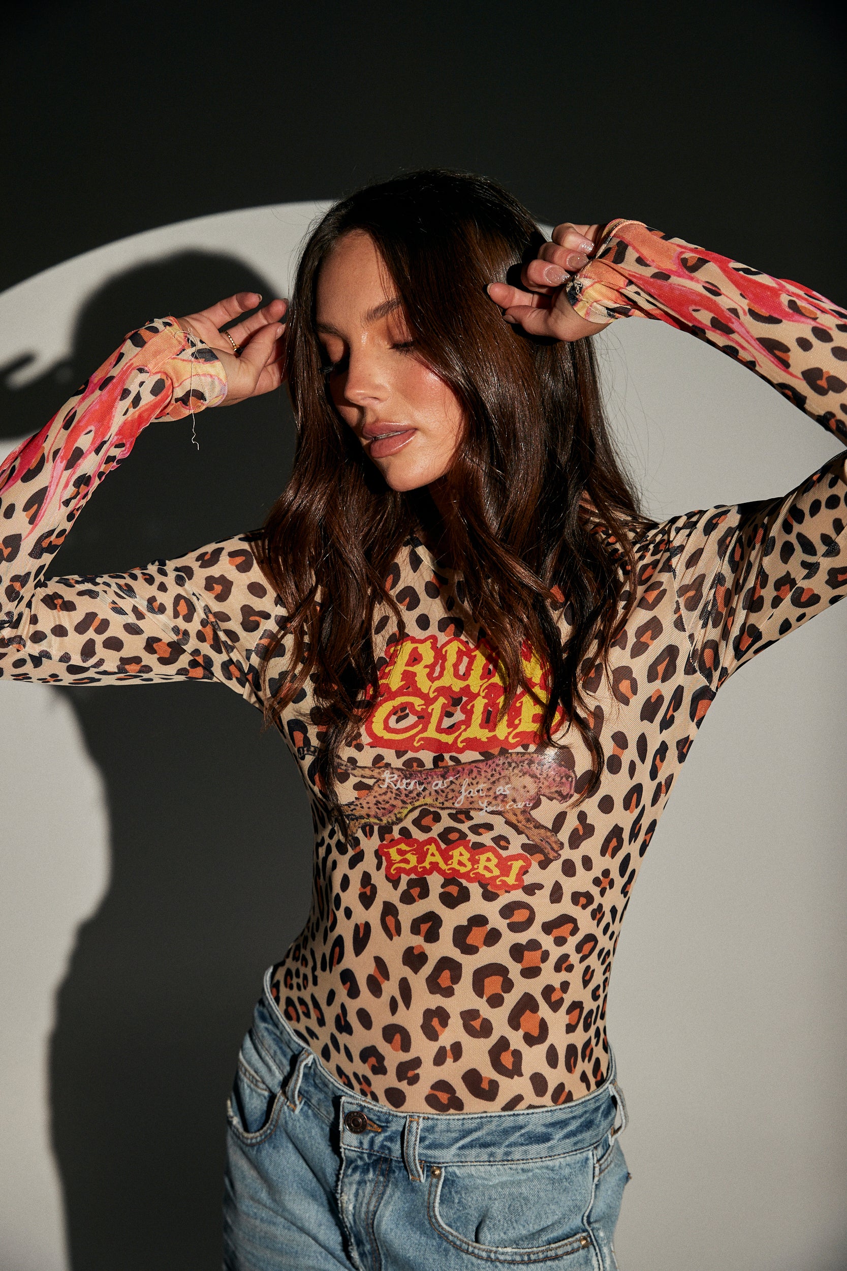 Sporty meets street with the Run Club Mesh Top – the ultimate layering piece for bold, active-inspired style. Crafted from lightweight, breathable mesh, it’s designed to keep you cool while serving serious attitude.