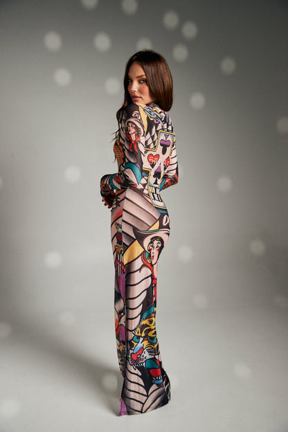 Turn heads and make a statement in The Got Ink Mesh Dress, a body-hugging masterpiece that fuses art and attitude. Crafted from sheer stretch mesh, this long-sleeve maxi dress is drenched in bold tattoo-inspired graphics—tigers, skulls, pin-up icons, and classic ink motifs—that wrap around the body like a second skin. Designed with a sleek silhouette, it flatters every curve while serving unapologetic confidence.