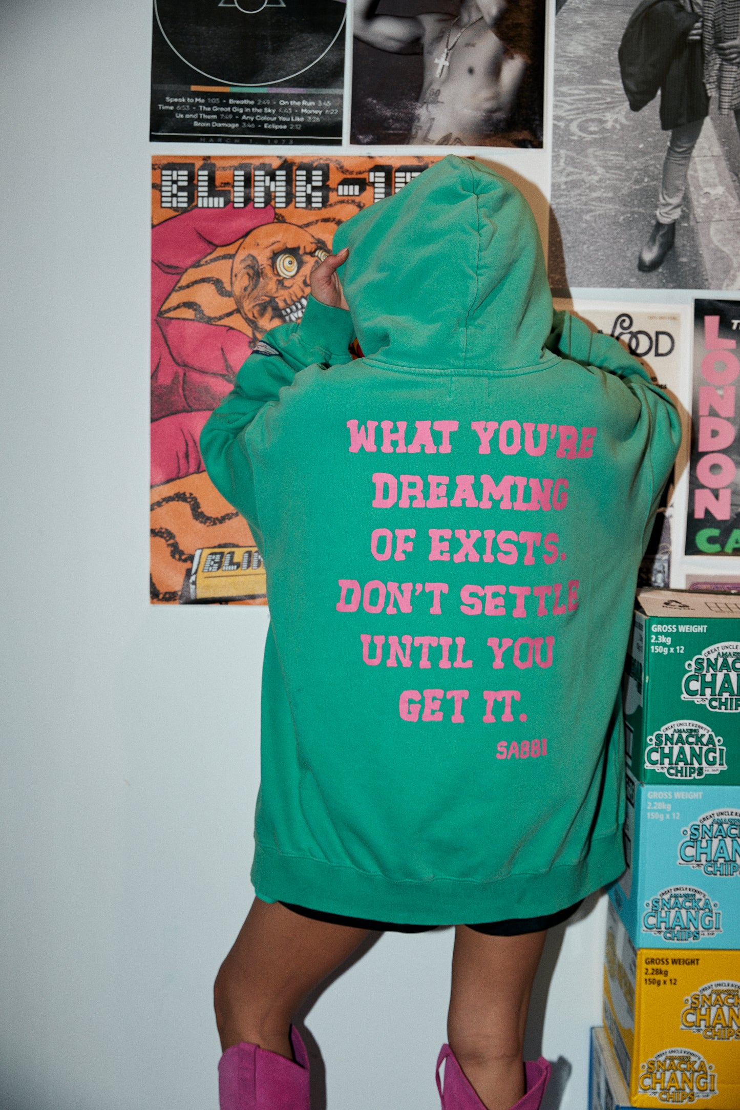 Laid-back comfort. Bold self-expression.
The Self Love Club Hoodie in Green is crafted from ultra-soft cotton fleece for an oversized, lived-in feel. Featuring a vibrant collegiate-inspired logo at the front and an empowering statement printed across the back, it’s a reminder to chase your dreams unapologetically. Finished with a spacious kangaroo pocket and cozy hood, this hoodie blends streetwear attitude with all-day comfort.