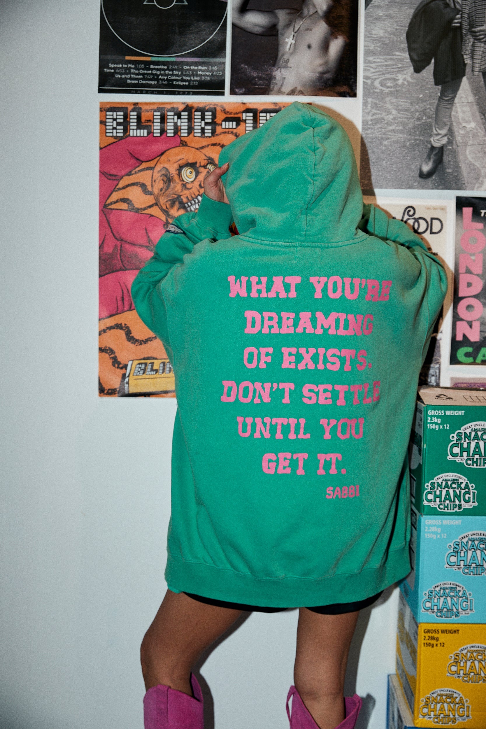 Laid-back comfort. Bold self-expression.
The Self Love Club Hoodie in Green is crafted from ultra-soft cotton fleece for an oversized, lived-in feel. Featuring a vibrant collegiate-inspired logo at the front and an empowering statement printed across the back, it’s a reminder to chase your dreams unapologetically. Finished with a spacious kangaroo pocket and cozy hood, this hoodie blends streetwear attitude with all-day comfort.