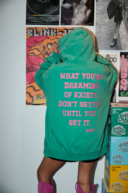 Laid-back comfort. Bold self-expression.
The Self Love Club Hoodie in Green is crafted from ultra-soft cotton fleece for an oversized, lived-in feel. Featuring a vibrant collegiate-inspired logo at the front and an empowering statement printed across the back, it’s a reminder to chase your dreams unapologetically. Finished with a spacious kangaroo pocket and cozy hood, this hoodie blends streetwear attitude with all-day comfort.