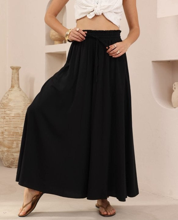 Iris Maxi - Flowy, flattering and made to move with you. The Melanie Pants – Iris Maxi are the ultimate blend of comfort and elegance, designed for effortless everyday wear with a polished finish.

Featuring a wide-leg silhouette and soft, fluid fabric, these pants drape beautifully while offering a relaxed, breathable feel. 