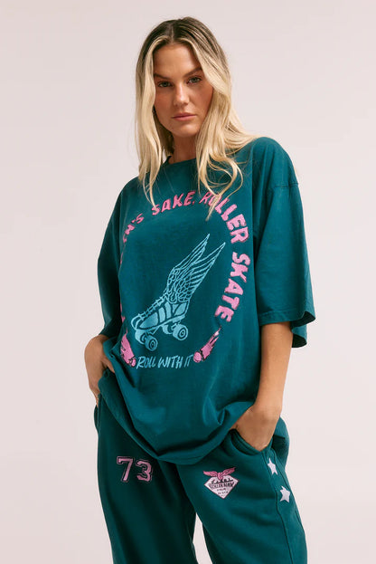 The Very Oversized Skate Don't Hate Tee

Just roll with it!

The Very Oversized Skate Don't Hate Tee is for dare-devils cutting shapes on the roller skating rink or carving up the bowl with the local skater crew.

Designed in a very oversized, relaxed silhouette, this tee features a bold, hand-drawn flying rollerskate graphic front and 'Sabbi Roller Rink - Palm Beach' graphic on the back.