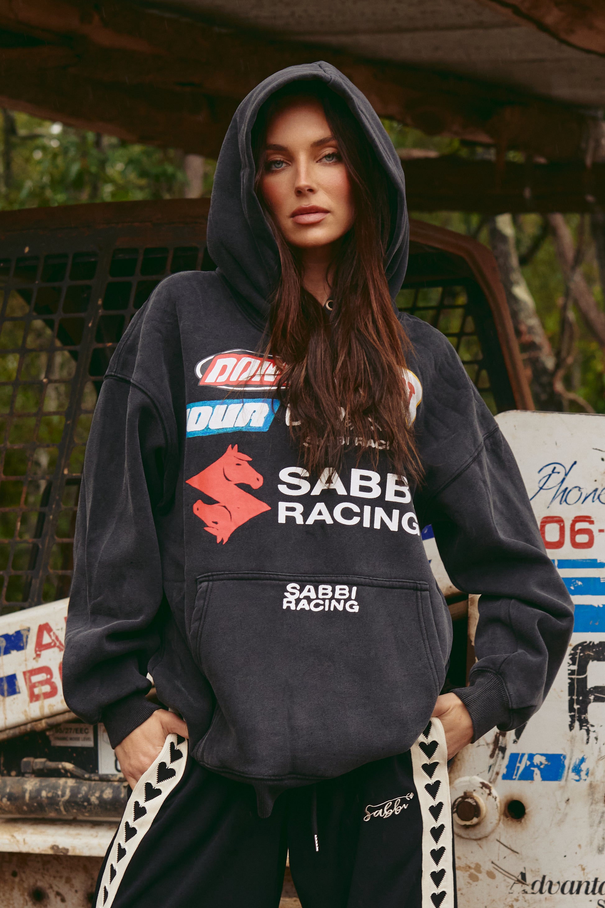 DON'T QUIT YOUR DAY DREAM HOODIE – BLACK

Rev up your streetwear game with the Don’t Quit Your Day Dream Hoodie in black – where off-duty comfort meets high-octane style. Inspired by bold motorsport energy, this oversized hoodie features striking retro racing graphics, the iconic Sabbi double-horse logo, and powerful statement patches that command attention from every angle.