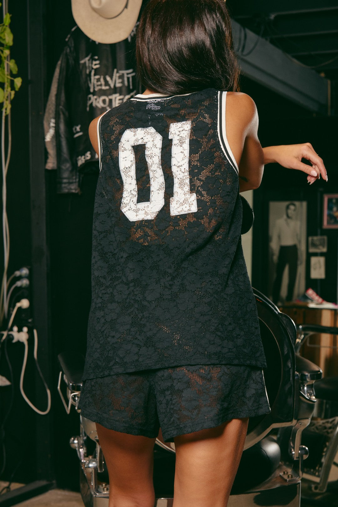 Bring bold energy to your wardrobe with The Lace Basketball Singlet - Black, where sport meets seduction. Crafted from intricate floral lace, this oversized singlet reimagines classic athletic style with a rebellious, feminine edge.
