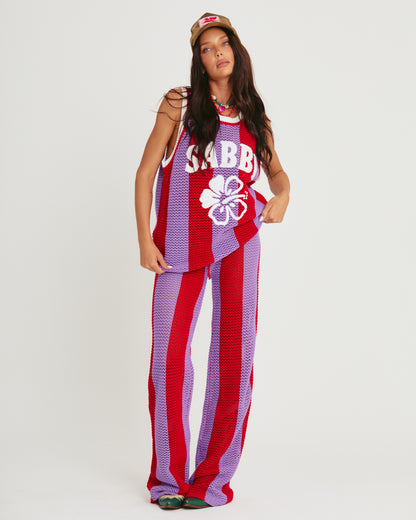 THE KNIT B-BALL SINGLET — PURPLE STRIPE -SABBI

Bring the heat and serve all the courtside attitude in THE KNIT B-BALL SINGLET – PURPLE STRIPE. A bold, retro-sport moment meets handcrafted energy, this statement knit is here to steal the spotlight (and hearts).

Designed in eye-popping purple and fire red stripes, this breathable open-weave crochet singlet is your new go-to for festival days, coastal hangs, or any moment you feel like being unmissable. Featuring an oversized fit, contrast rib trims, and our