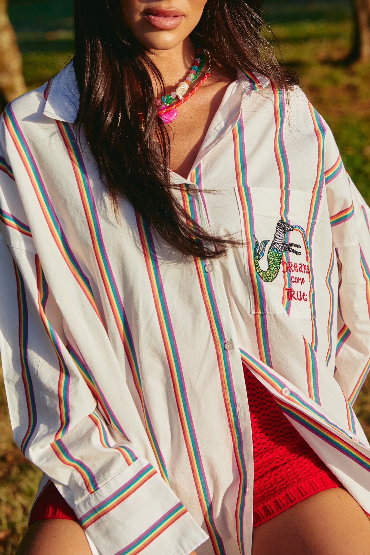 Meet your new happy place in shirt form — the Don Julio Shirt - Rainbow Dreams. This oversized statement piece radiates pure joy with its vibrant rainbow stripes and playful vintage energy.