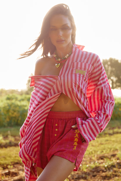 THE DON JULIO SHIRT – PINK STRIPE - SABBI

Turn up the sunshine in the Don Julio Shirt – the bold, playful statement your wardrobe has been waiting for. Bursting with pink stripe perfection, this oversized button-up brings effortless attitude and a whole lot of flirt to any look.