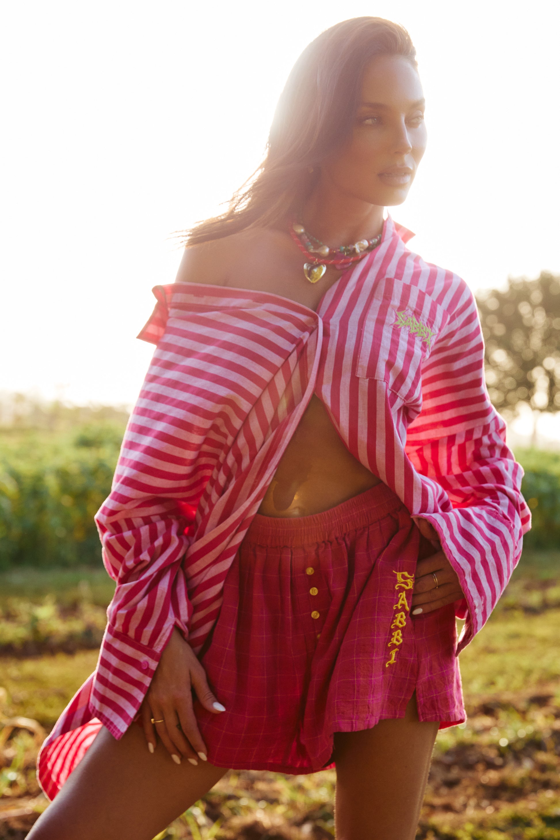 THE DON JULIO SHIRT – PINK STRIPE - SABBI

Turn up the sunshine in the Don Julio Shirt – the bold, playful statement your wardrobe has been waiting for. Bursting with pink stripe perfection, this oversized button-up brings effortless attitude and a whole lot of flirt to any look.