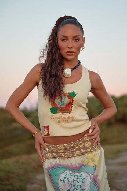 Sabbi - Sun-kissed, salty and made for endless summer days. The Long Time No Sea Tank is your go-to fitted tank for warm weather wanderings and coastal living. Designed with a flattering scoop neckline and a softly structured fit, this piece hugs just right while still feeling easy and breathable.