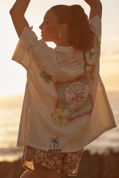 Sabbi - Meet your new coastal statement piece. The Patron Shirt in Cream Seas the Day is relaxed, expressive and effortlessly cool—made for salty air, sun-faded afternoons and spontaneous adventures. Featuring playful hand-drawn graphics inspired by beach days and carefree living, this shirt brings art and attitude together in one easy throw-on layer.
