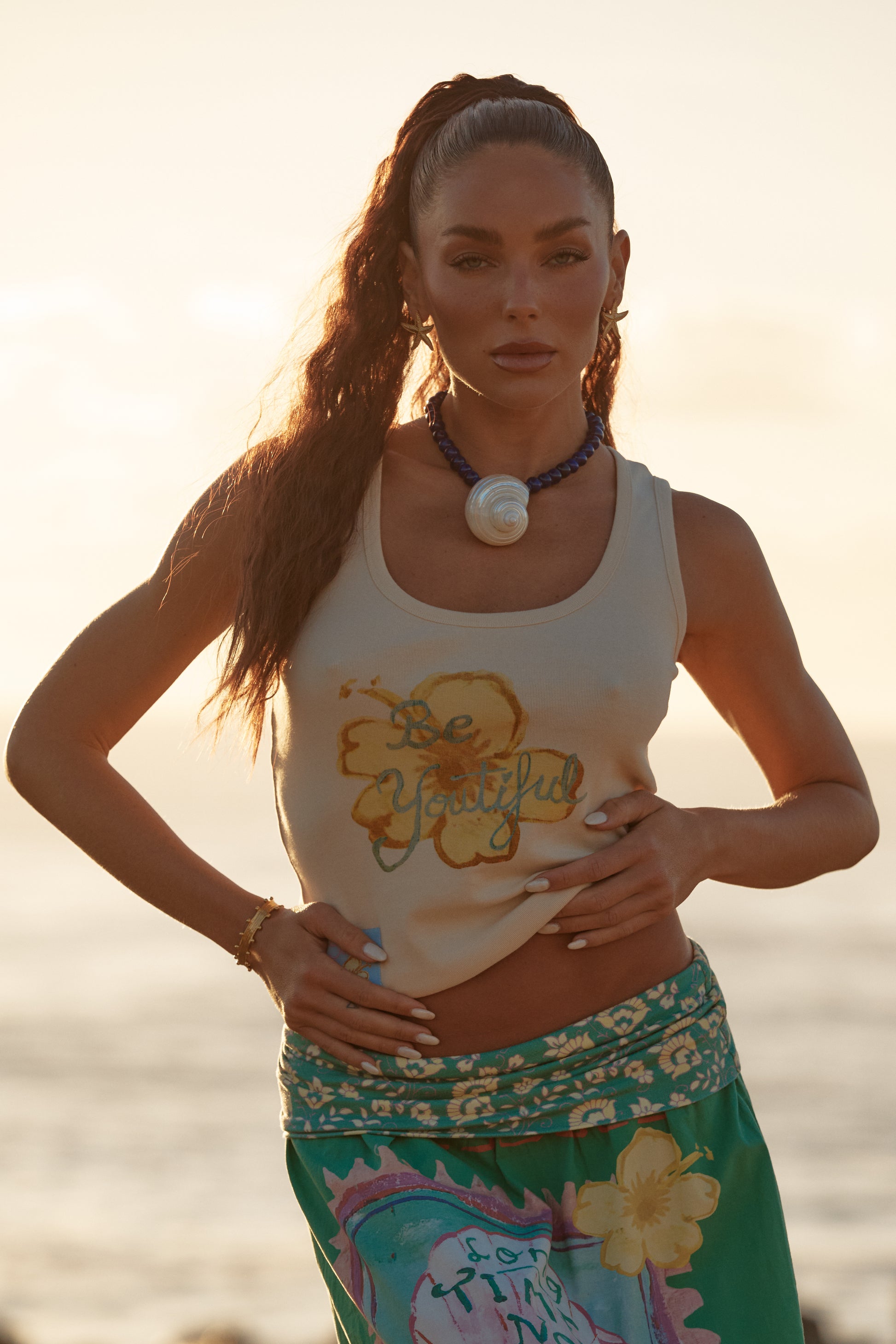 Sabbi - A little reminder you can wear. The Be-Youtiful Tank is all about easy confidence, sun-kissed tones and that feel-good, beachside energy. Crafted in a soft, breathable fabric with a flattering, fitted silhouette, this tank hugs just right while still feeling effortless.