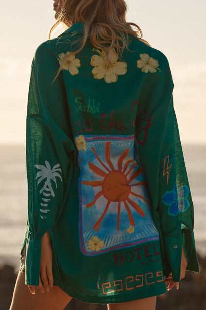 Sabbi - Meet your statement layer for sun-soaked days and golden-hour nights. The Don Julio Shirt – Green is effortlessly cool with a relaxed, oversized fit and a sheer, lightweight feel that moves beautifully with you. Drenched in rich green tones and detailed with playful Seas the Day artwork, this piece brings vintage surf energy with a bold Sabbi twist.