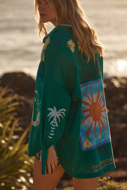 Sabbi - Meet your statement layer for sun-soaked days and golden-hour nights. The Don Julio Shirt – Green is effortlessly cool with a relaxed, oversized fit and a sheer, lightweight feel that moves beautifully with you. Drenched in rich green tones and detailed with playful Seas the Day artwork, this piece brings vintage surf energy with a bold Sabbi twist.